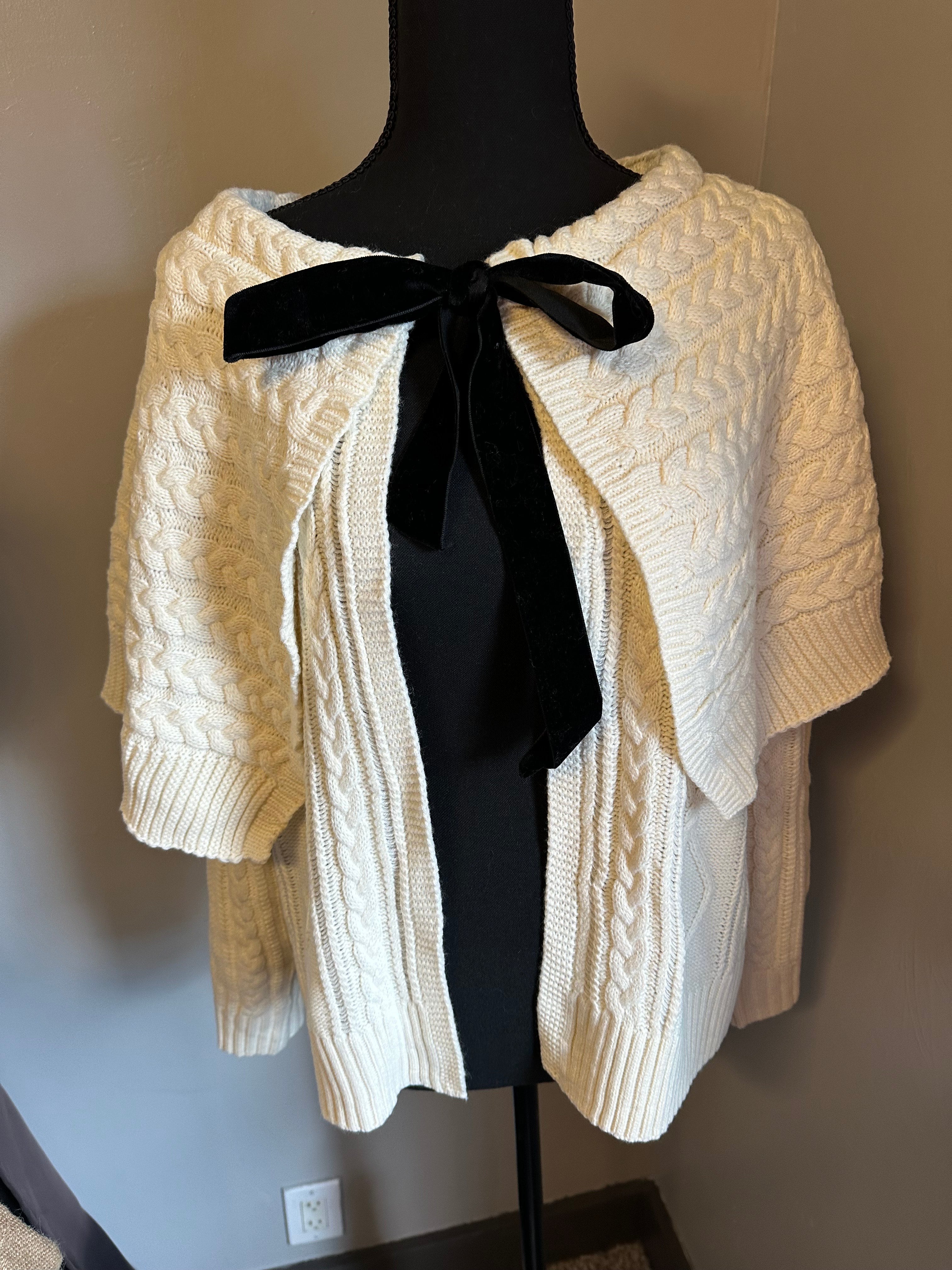 Cable knit cardigan with velvet black bow